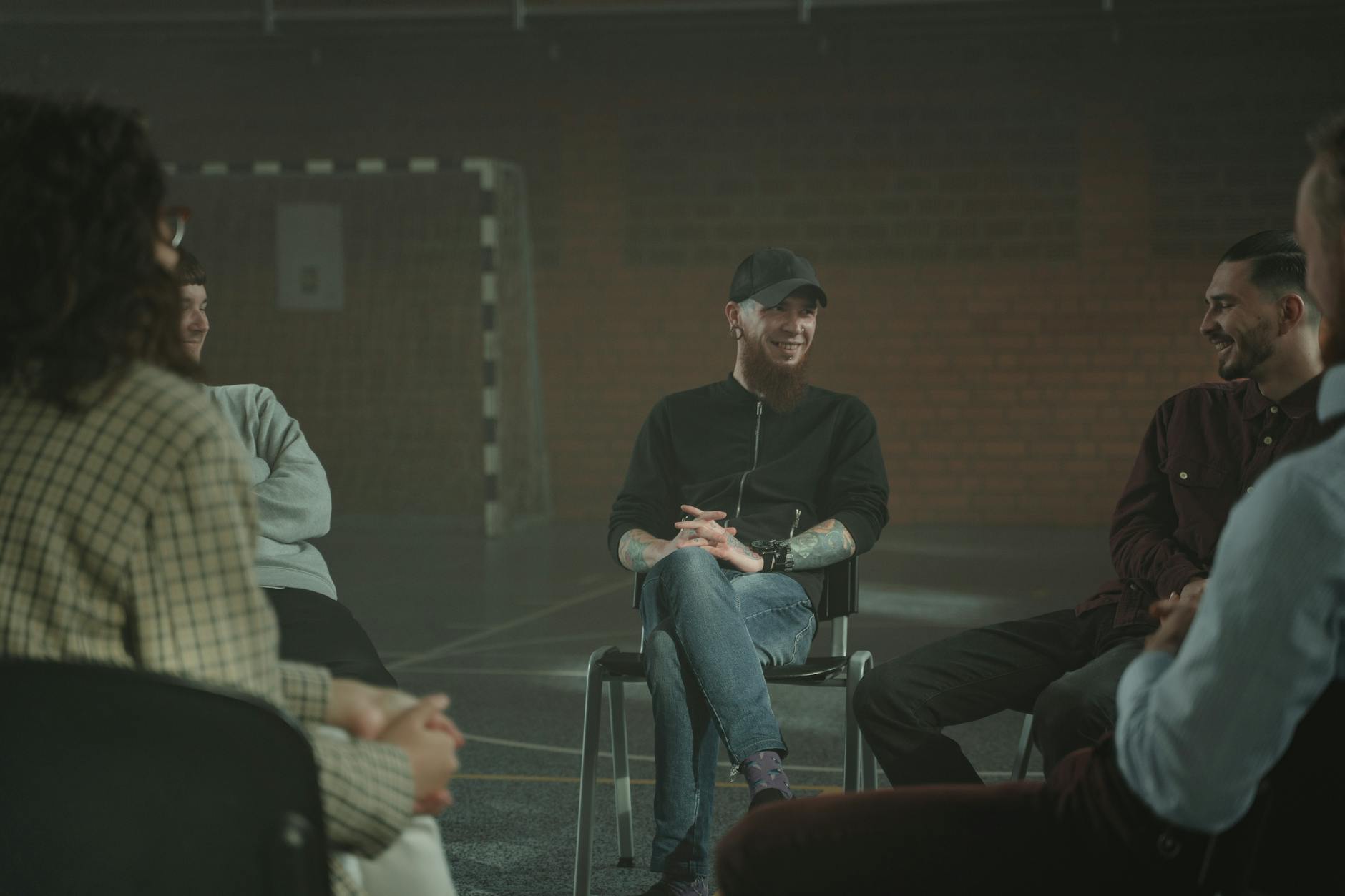 A group of diverse individuals engaged in a respectful debate, showcasing active listening and empathy. — debating sensi…